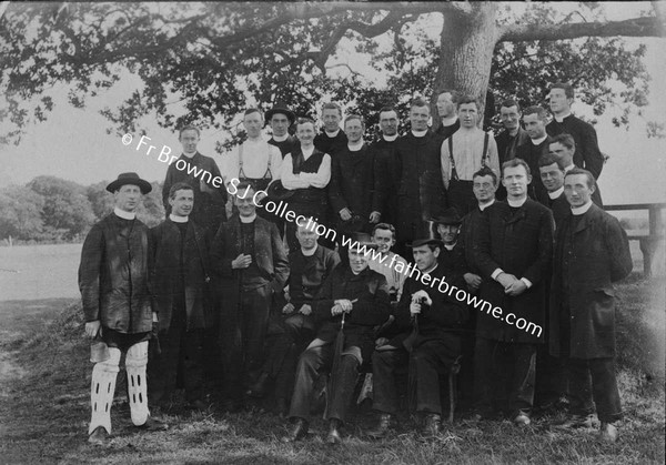 S.J. GROUP OF PRIESTS WITH SELF IN CRICKET PADS